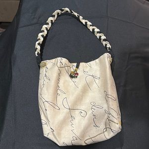 Sleek Sassy reversible bag/purse with removable insert.